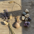 Flat lay with actual fossil pendant